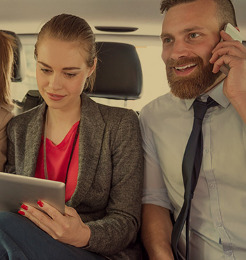 managers in a corporate car